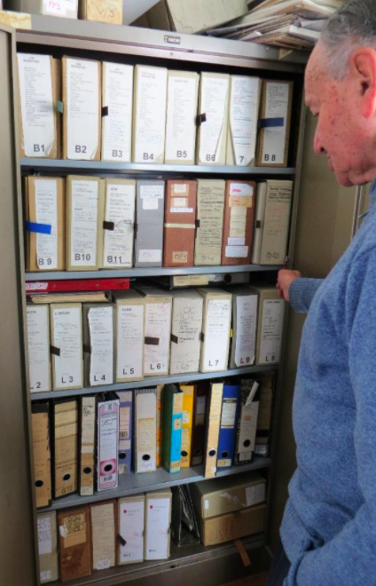 Clive Chipkin and his archive before removal to Wits