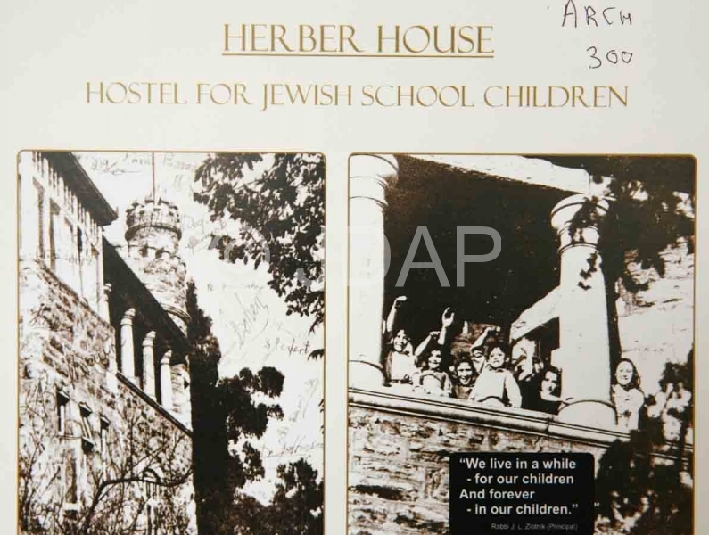 Pictures from a brochure promoting the Herber House hostel, clearly showing the turret, pillars and stone walls. 