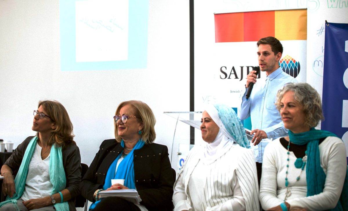 The author introducing the Women Wage Peace delegation. From left, Yasmin Rubin-Cooper, Hyam Tannous, Manar Abu Dahl and Vered Eyal-Saldinger.