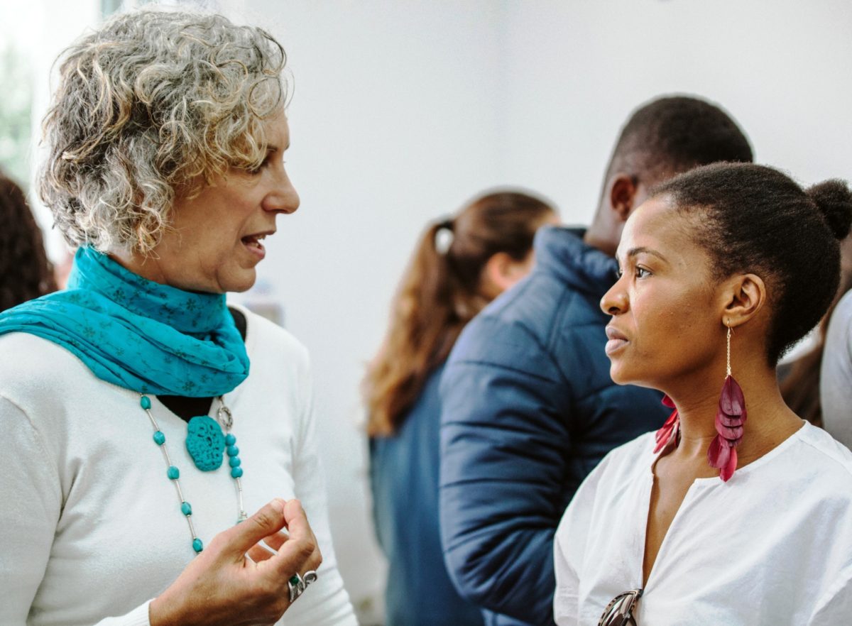 Women Wage Peace delegate Vered Eyal Saldinger engaging with Graca Lekola-Modiba at the youth event.