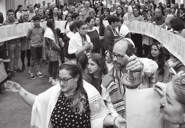 Simchat Torah celebration in Cape Town, led by Rabbis Emma Gottlieb and Malcolm Matitiani